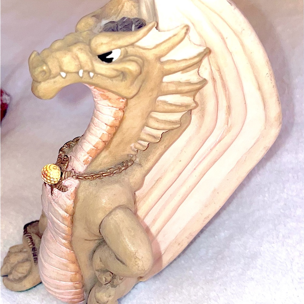 Krystonia Dragon standing wearing a crystal ball